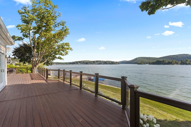 deck featuring a water view