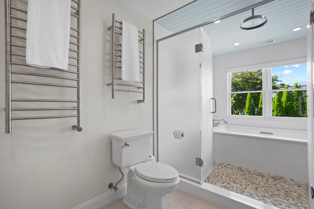 bathroom featuring tile patterned floors, independent shower and bath, toilet, and radiator