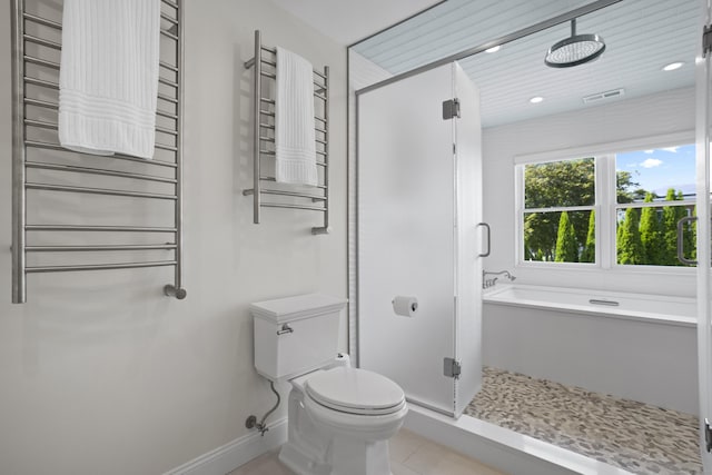 bathroom with toilet, tile patterned floors, radiator, and separate shower and tub