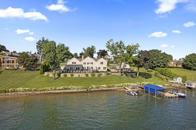 exterior space featuring a water view and a lawn