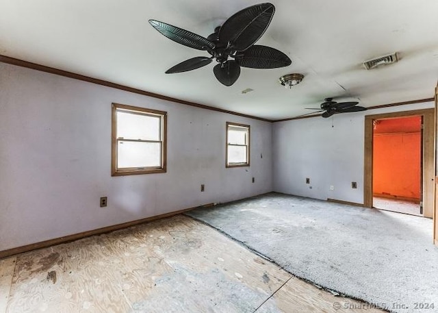 unfurnished room featuring ceiling fan and ornamental molding