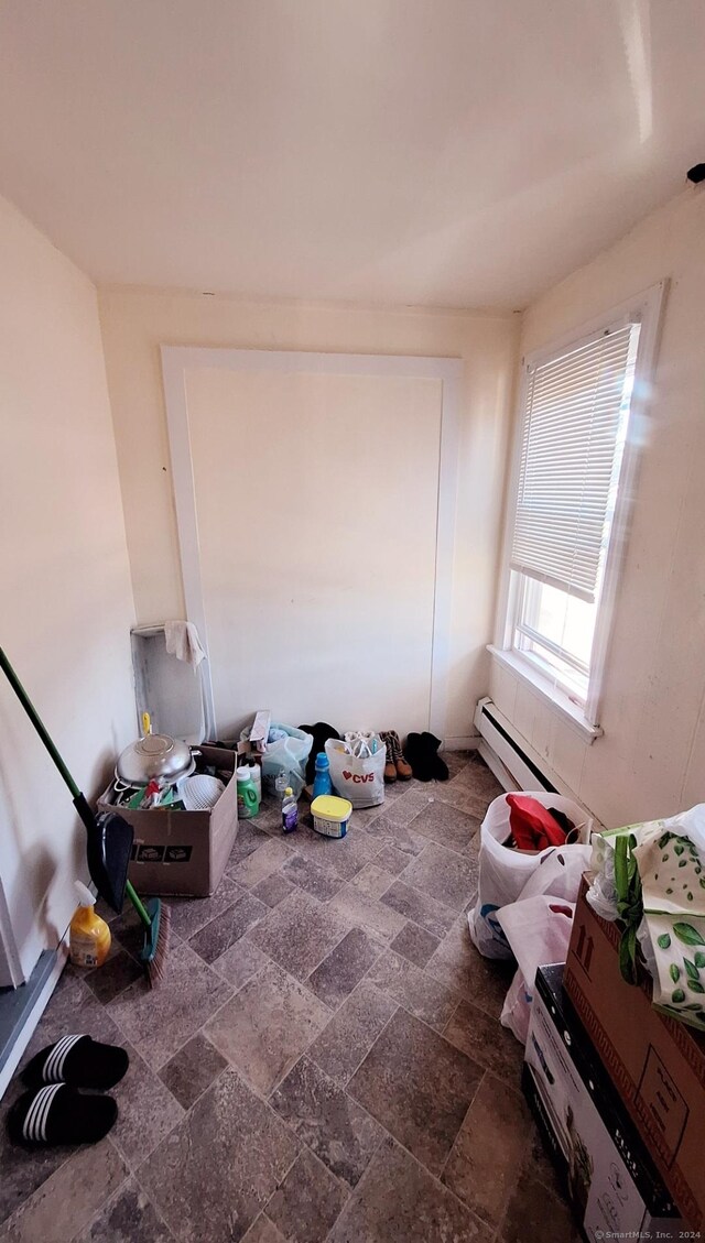 interior space with a baseboard radiator