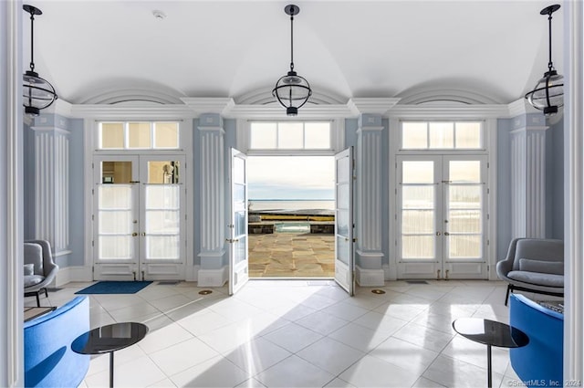 doorway with plenty of natural light, french doors, and light tile patterned floors