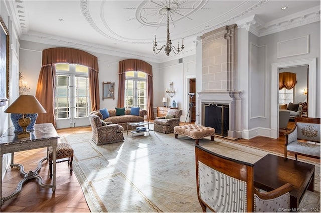 living room featuring a fireplace, parquet flooring, a chandelier, and ornamental molding