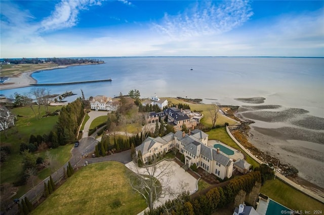 birds eye view of property with a water view