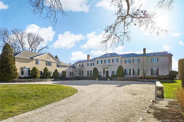 view of front of property with a front lawn