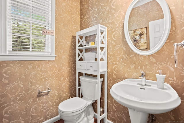 bathroom with sink and toilet