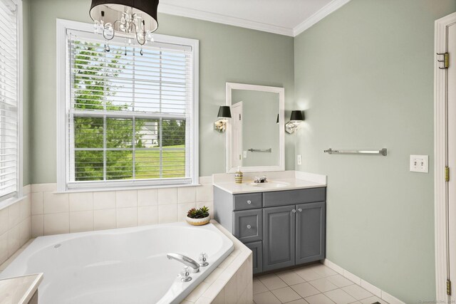 bathroom featuring tiled tub, vanity, a healthy amount of sunlight, and tile patterned flooring