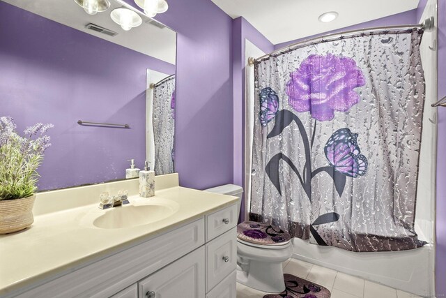 full bathroom with vanity, shower / bath combo, tile patterned flooring, and toilet