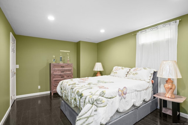 bedroom featuring baseboards, wood finished floors, and recessed lighting