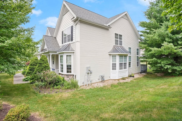 view of property exterior featuring a yard