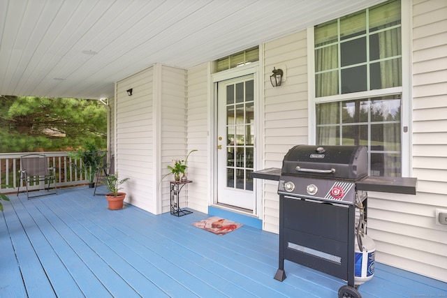 wooden deck featuring area for grilling