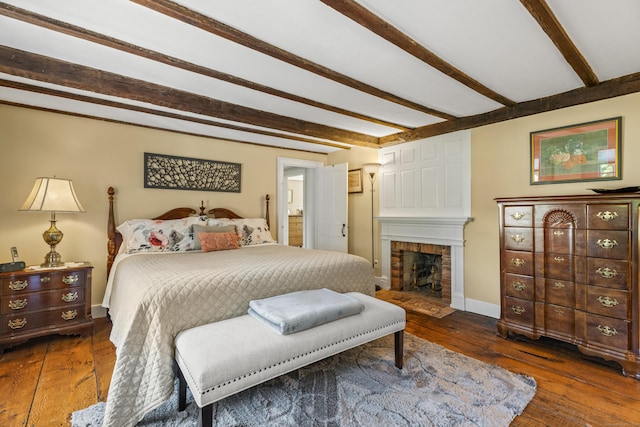 57 NW Corner Rd, Preston, CT 06365 - bedroom featuring wood-type flooring, baseboards, a brick fireplace, and beamed ceiling