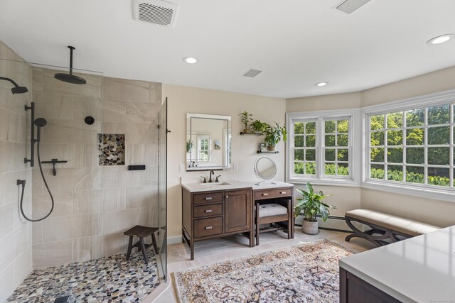 57 NW Corner Rd, Preston, CT 06365 - bathroom with visible vents, vanity, baseboards, recessed lighting, and a tile shower