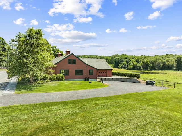 57 NW Corner Rd, Preston, CT 06365 - exterior space featuring a lawn, central AC unit, a chimney, and driveway