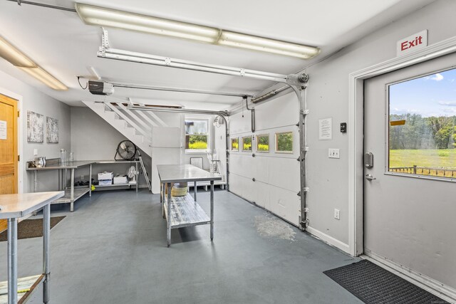 57 NW Corner Rd, Preston, CT 06365 - garage featuring baseboards and a garage door opener