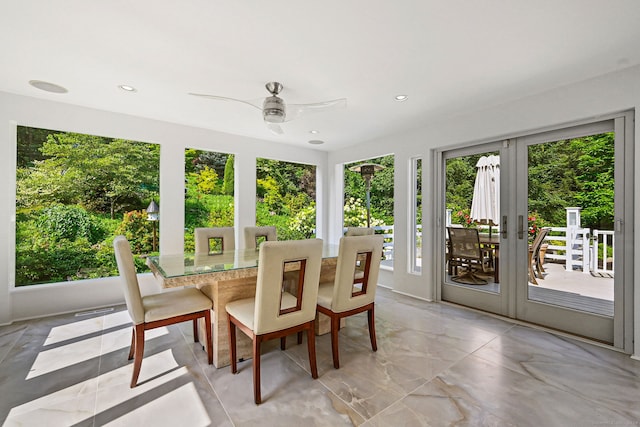 sunroom / solarium with french doors and ceiling fan