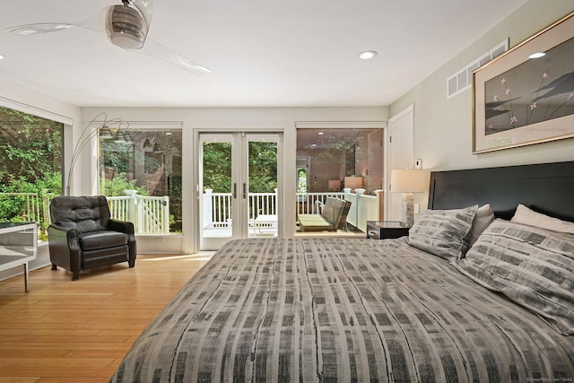 bedroom featuring visible vents, wood finished floors, access to exterior, french doors, and recessed lighting