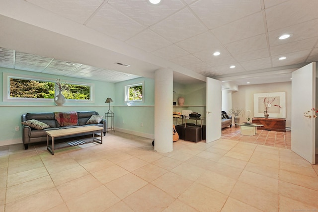 living room with recessed lighting, visible vents, tile patterned flooring, a drop ceiling, and baseboards