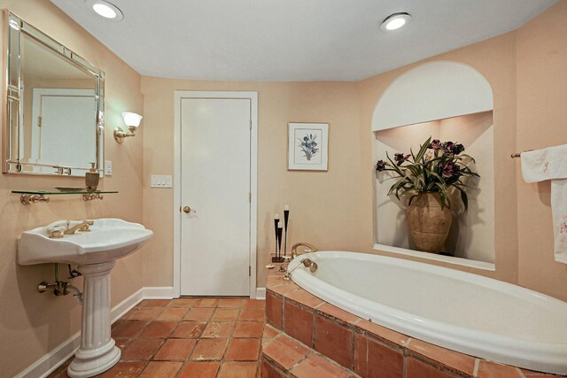 bathroom featuring tiled bath