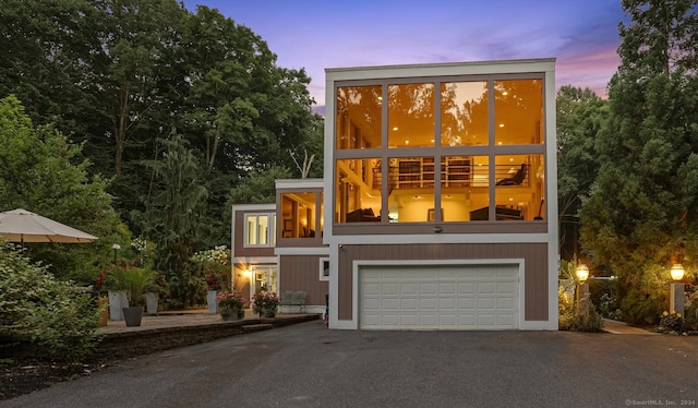 modern home with a balcony and a garage