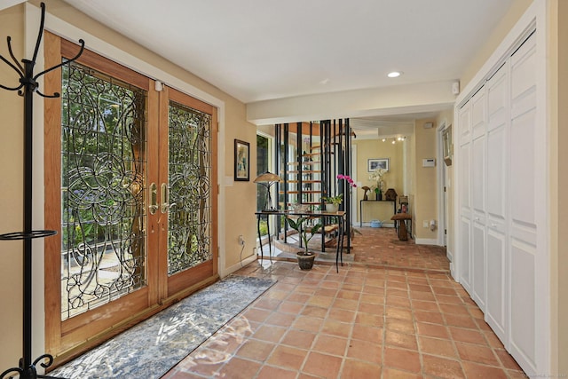 interior space featuring recessed lighting, french doors, plenty of natural light, and baseboards