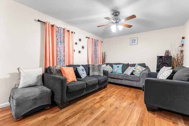 living room with ceiling fan and light hardwood / wood-style floors