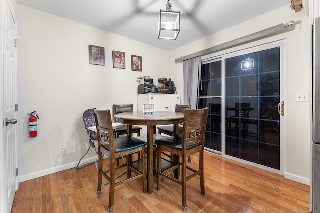 dining space featuring hardwood / wood-style flooring