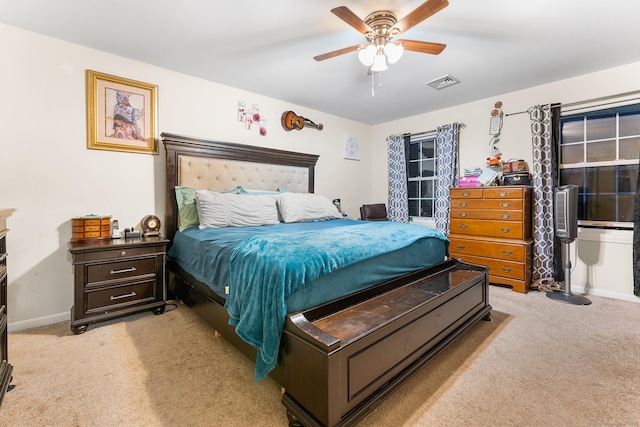 carpeted bedroom with ceiling fan