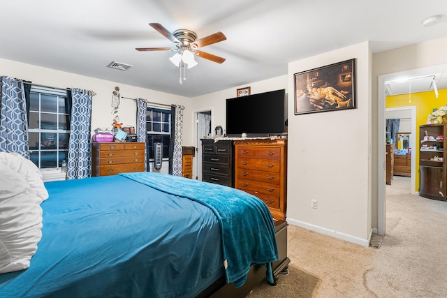 bedroom featuring light carpet and ceiling fan