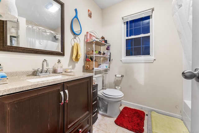 bathroom with tile patterned floors, toilet, and vanity