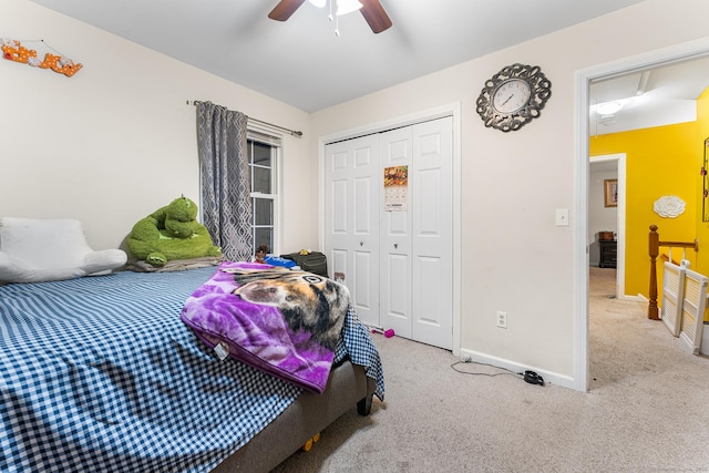 carpeted bedroom featuring a closet and ceiling fan