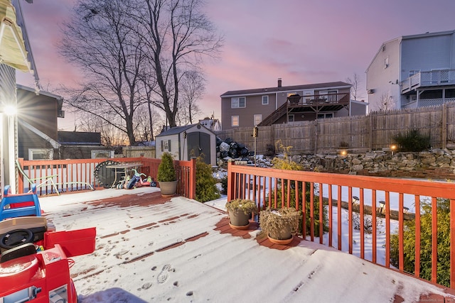 deck at dusk with a storage unit