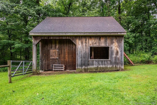 view of outdoor structure with a lawn