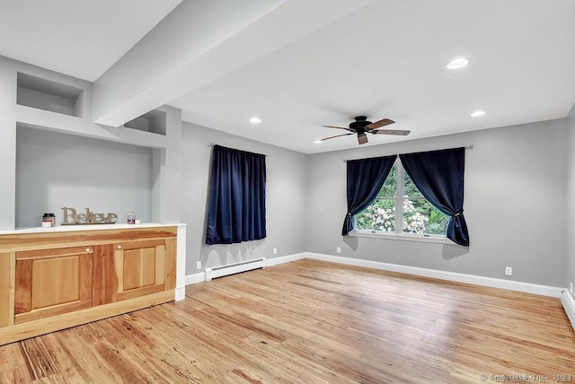 interior space featuring ceiling fan, light hardwood / wood-style floors, and a baseboard heating unit