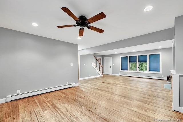 unfurnished living room with ceiling fan, light hardwood / wood-style floors, and baseboard heating