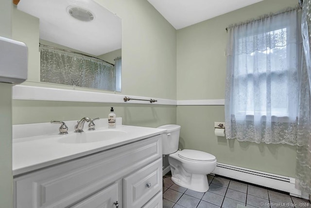 bathroom featuring walk in shower, vanity, a baseboard heating unit, tile patterned flooring, and toilet