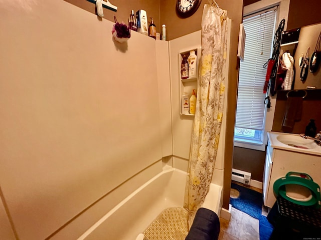 bathroom with tile patterned floors, vanity, shower / tub combo, and a baseboard radiator