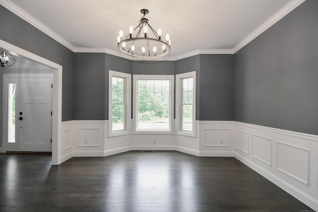 interior space featuring dark hardwood / wood-style floors, ornamental molding, and a chandelier