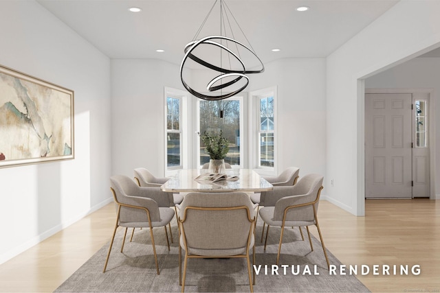 dining room featuring a chandelier and light wood-type flooring