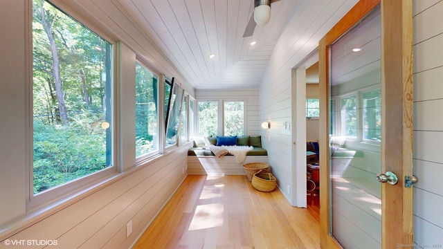 sunroom / solarium with lofted ceiling and wood ceiling