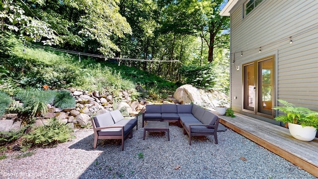 view of patio featuring an outdoor hangout area and a wooden deck