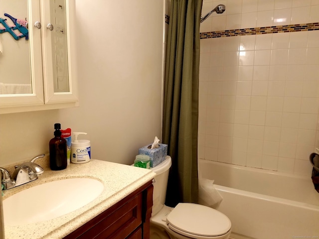 full bathroom featuring shower / bath combination with curtain, vanity, and toilet