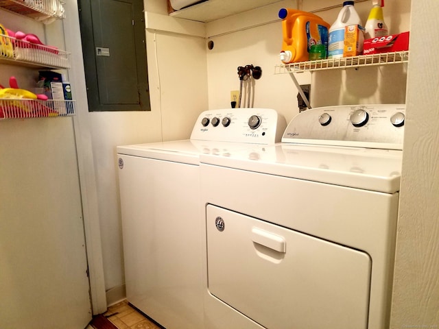 laundry area with washer and dryer, laundry area, and electric panel