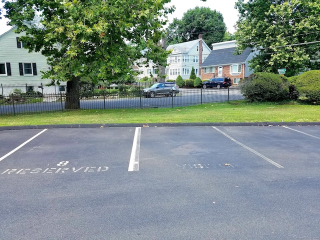 uncovered parking lot with fence