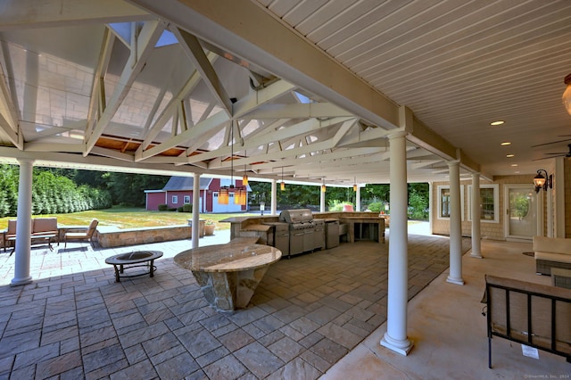 view of patio / terrace with a grill, ceiling fan, and area for grilling