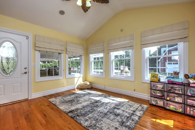 foyer featuring vaulted ceiling, wood-type flooring, and ceiling fan