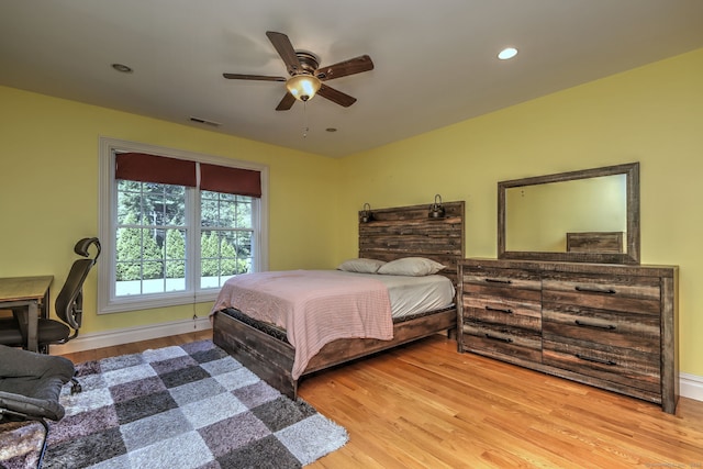 bedroom featuring light hardwood / wood-style flooring and ceiling fan