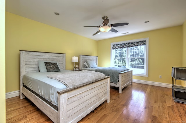 bedroom featuring ceiling fan and light hardwood / wood-style floors