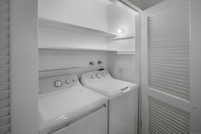 laundry area with washing machine and dryer